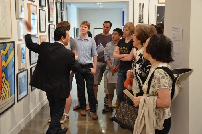 MIT Students looking at art for the Student Lottery.