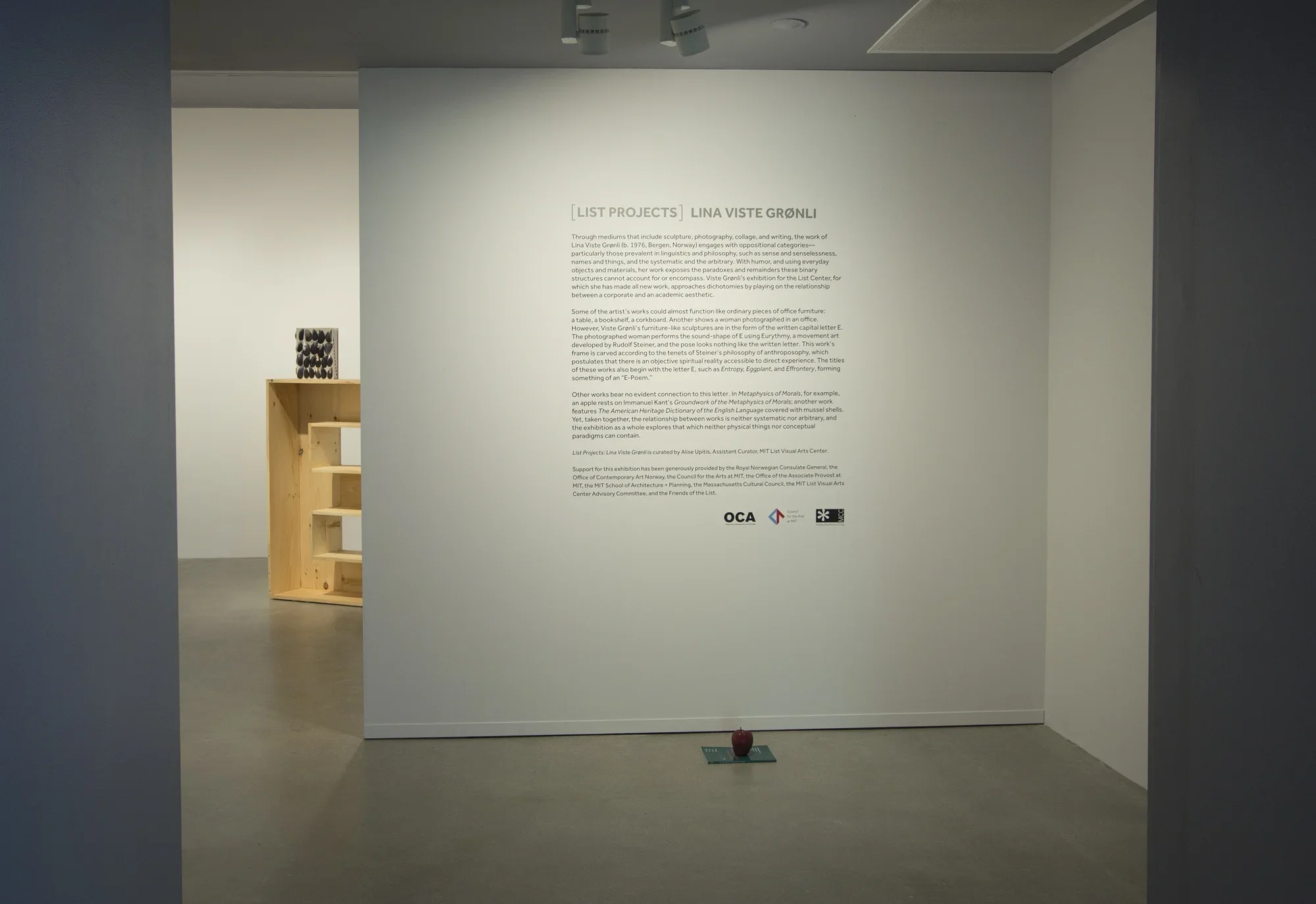 A gallery wall features vinyl text that reads "List Projects Lina Viste Grønli".