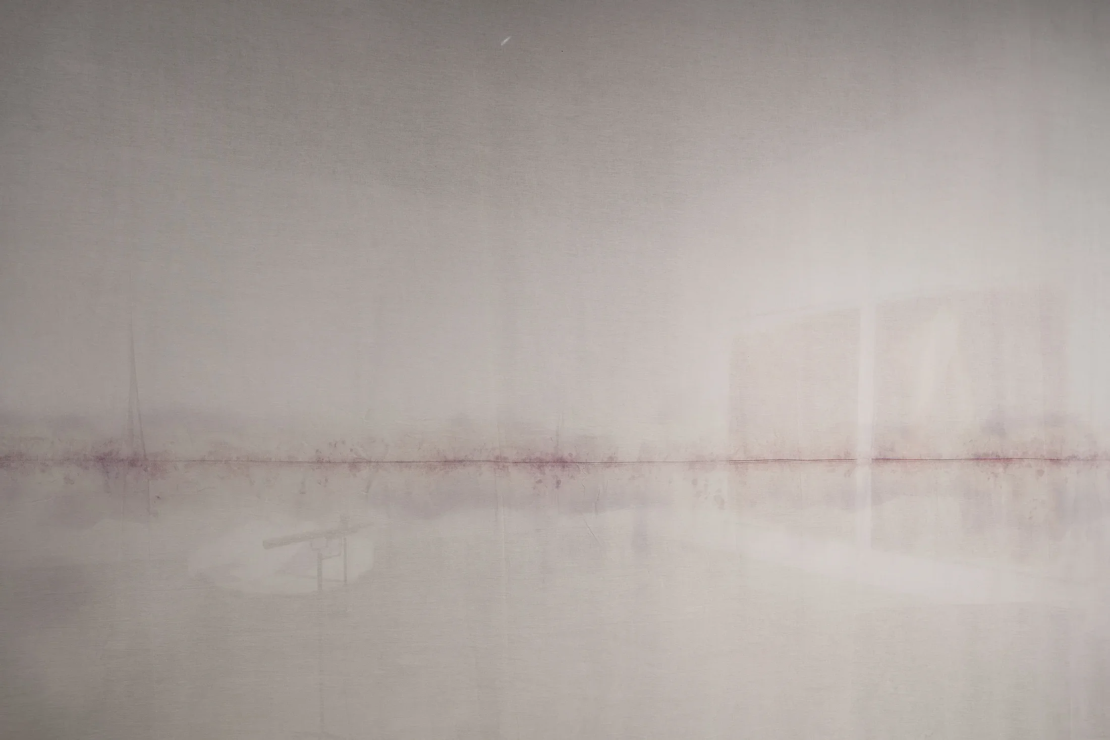 Detail of hanging fabric with lavender marks running down the middle, fingerprints revealed with forensic developer