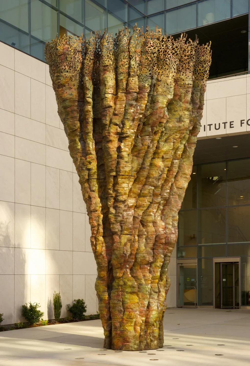 Sculpture that appears to be made of wood and resembled an upside down tree trunk.