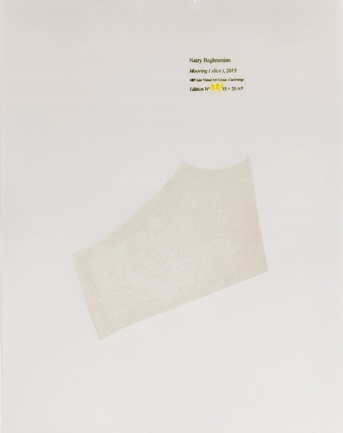 A piece of fabric in the center on the frame and text in the upper right that includes artist name, image title, MIT List Center and the edition.