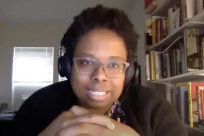 Screenshot from artist talk featuring closeup of Jamillah Jones speaking