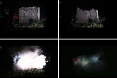 4 images from a video still of a building falling down from an explosion.