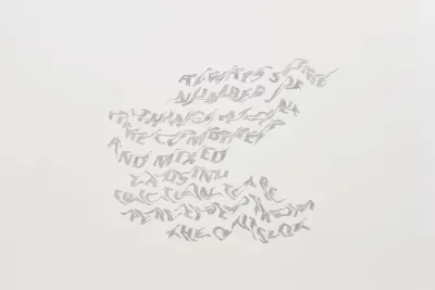 A large-scale mural of distorted graphite-like text and a beer can discarded in corner.