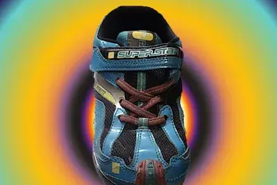 Rainbow colored image with a child's sneaker in the center.