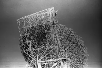 Black and whte image of a large architectural sculpture made from scaffolding.