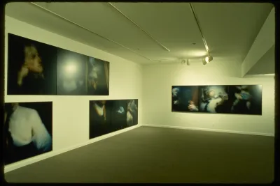 Triptychs line the walls of the gallery. Each of the three pieces in the triptics shows a detail from a historical artwork.