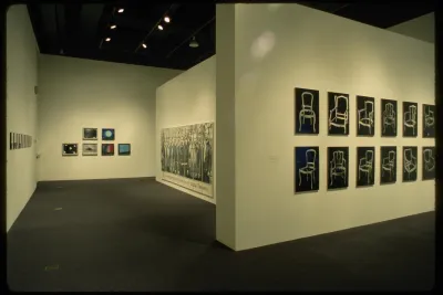 Photographs of all different subjects and sizes line the gallery walls. Images range from objects to portraits.  