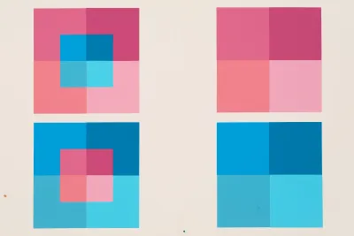 Painting with light pink and blue overlapping squares against a white background in a book.