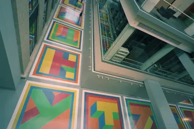 View from above of Sol LeWitt's floor installation including colorful geometric glass and epoxy terrazzo tiles.