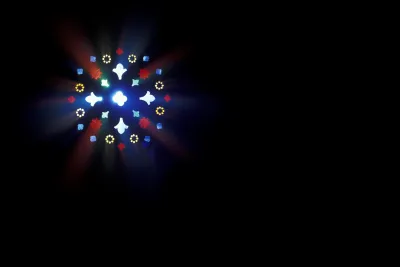 Red and clear light stream through a stain-glass window against a black background.