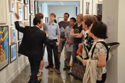 MIT Students looking at art for the Student Lottery.