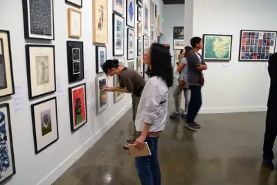 MIT Students looking at art for the Student Lottery.
