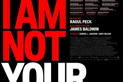 Photo of Lawrence Weiner's Dead Center includes pieces of Gray, red, and black granite that read "Dead Center" and " Poised At A Tanget To".