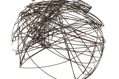 Large, spherical, brown-bronze-color metal-wire sculpture against a white background.