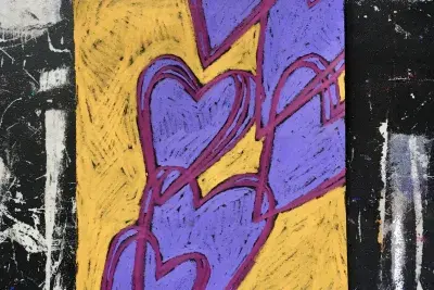 A drawing with purple hearts with a yellow outline and a black and white border.
