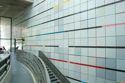 Painted aluminum on atrium wall featuring streaks of primary colors.