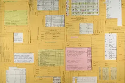 Pink, yellow, and white rubrics collaged together taking up the entire frame.