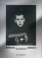 Book cover for Mirror Images: Women, Surrealism and Self-Representation featuring a black and white photograph of a man holding a mirrored sphere