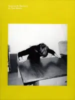 Bright yellow book cover for Gwenneth Boelens In Two Minds featuring a square black and white photograph of a person with both hands on a table leaning over the table.