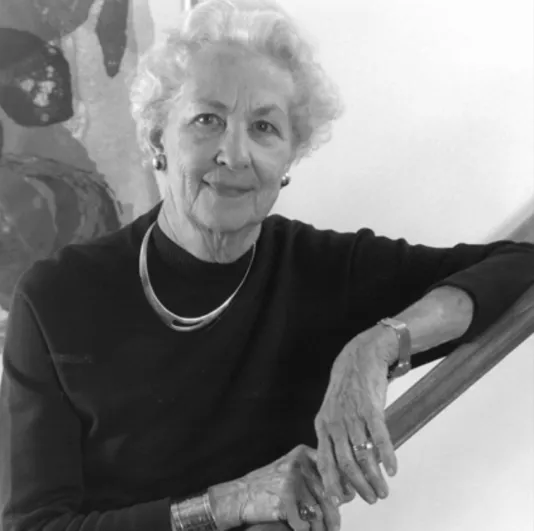 Black and white image of Catherine (Kay) N. Stratton with her arm propped up on a hand rail.