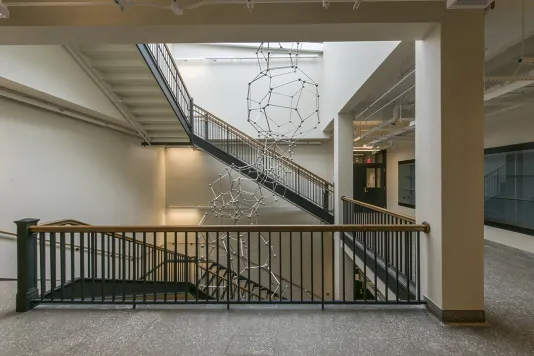 Sculpture made of thirty-three stainless steel polyhedrons reaching from the floor of the Simons Building to the skylight four stories above