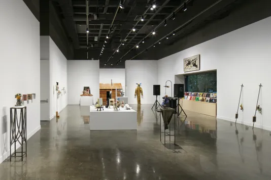 Installation view featuring various sculptures and records throughout the gallery.