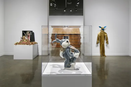 Sculpture of bugs bunny in the foreground with three other sculptures in the background.
