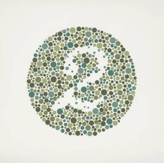 Circle with lots of small blue and green dots with white space in the center that makes out the number 2
