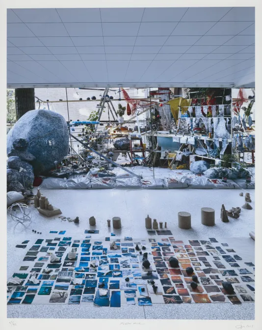 Archival giclée print of an artist's studio with works in process including small prints lined up in the foreground.