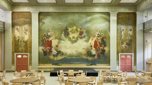 Large scale murals from floor to ceiling hung in a conference room. 