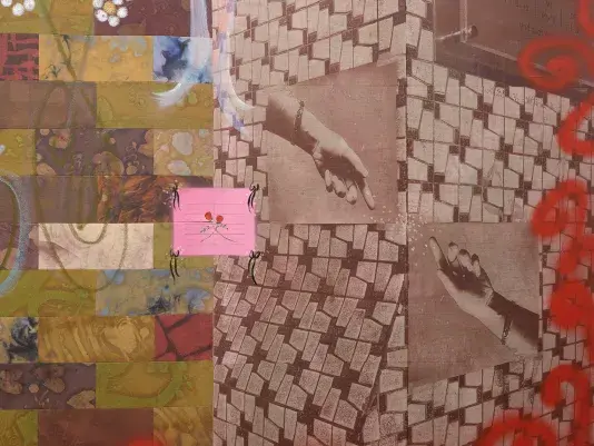A close-up detail of a painting. The left side features a brick-like motif composed of textured rectangles in shades of brown, green, red, and orange. On the right, a tile-like surface contains two photo transfers of hands reaching toward each other, with tiny flowers in between them. Along the right edge, red graffiti-like marks frame the painting.