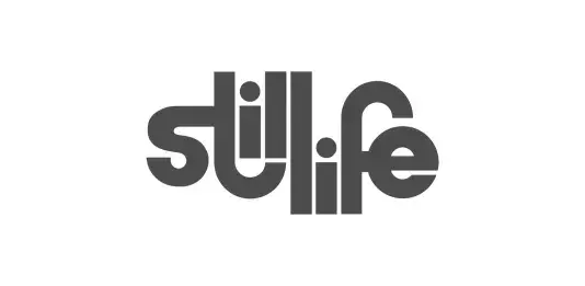Logo for Still Life Studios. Text reads "still life"