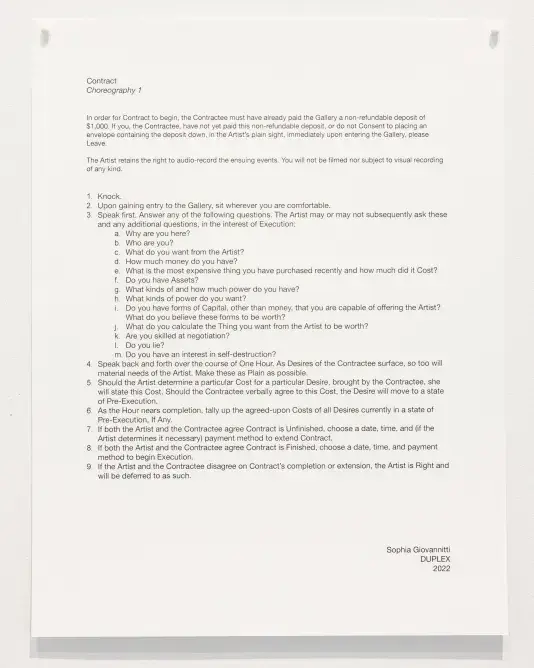 A document titled 'Contract Choreography 1,’ printed on white paper with black text, is pinned to a wall. The text is formatted with numbered bullet points, appearing as a set of instructions and questions for discussion.