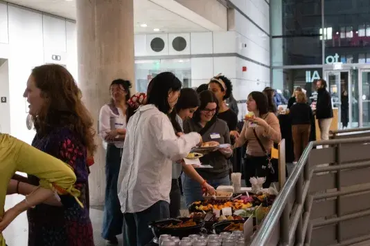 Image of attendees congregating in the atrium for the Connect at the List event in the MIT List Visual Arts Center.