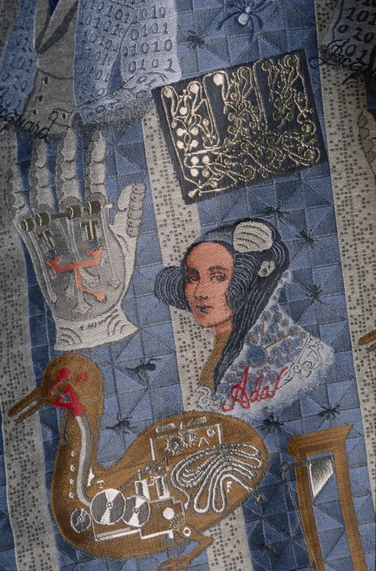 Image of Ada Lovelace, Prosthetic Hand, Duck Automation woven in blue, brown, gray, silver, white, red and black fibers