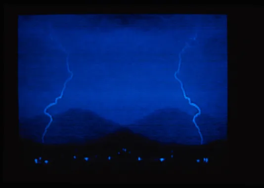 A photograph resembling lightning on a blue background. 