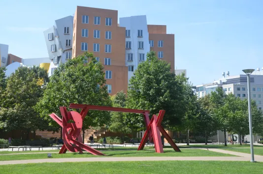 Mark di Suvero's red public art piece is featured on MIT campus.