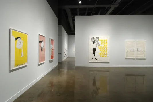 Installation view of the List Center gallery with a mix of colorful collages in white frames.