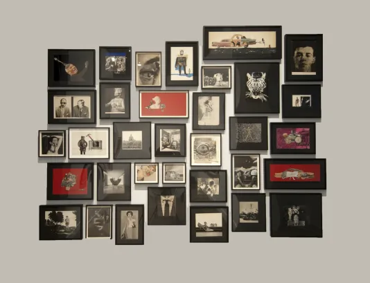 A collage of framed images in black, white and red.