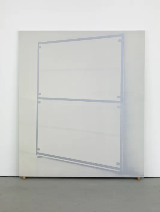 Large silkscreen of a leaning, angled canvas edged and bisected with a uniform brown line leans against the wall.