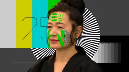 A woman with green slash marks over her face partly blends into the yellow, blue, green, black and white background graphics.