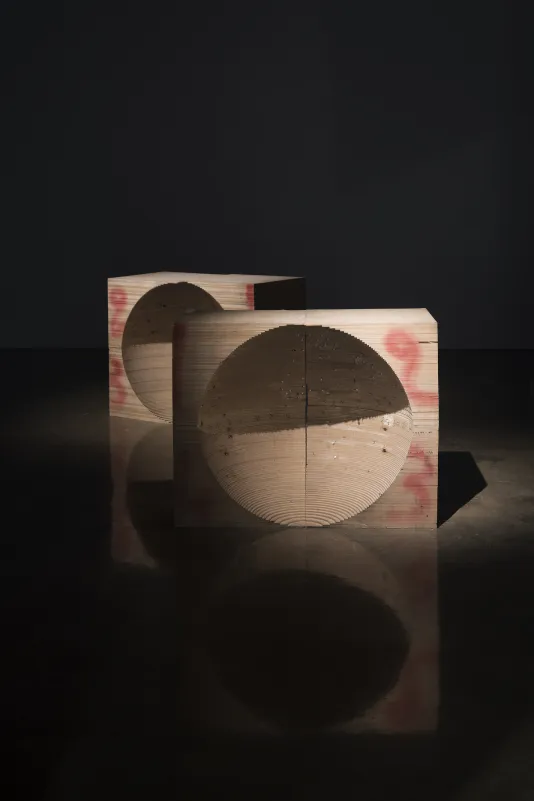 2 rectangular wood sculptures with hollowed out semi-spherical centers, “2” “3” painted in red on the wood edges