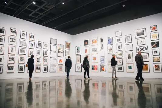 Two people attend the MIT List Arts Center SLAP Reception 2019.
