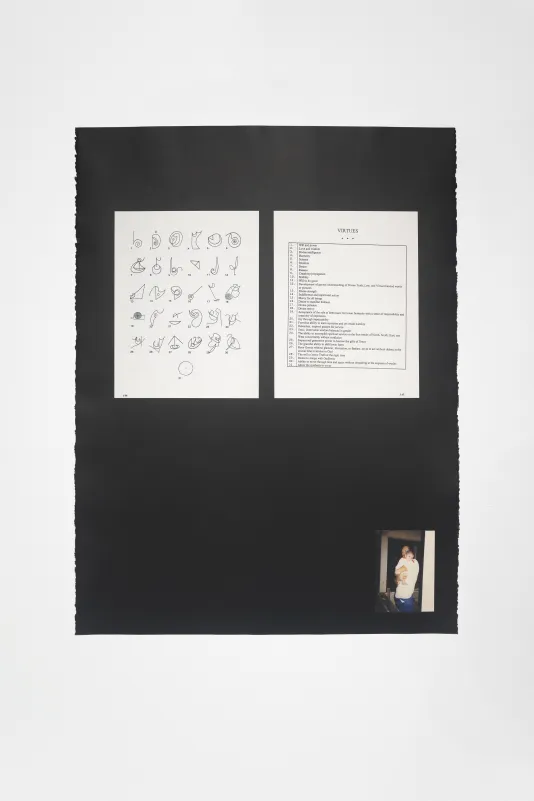 A page of black-and-white squiggly-line drawings and a list of “Virtues” above a color photo of dad and baby on black paper