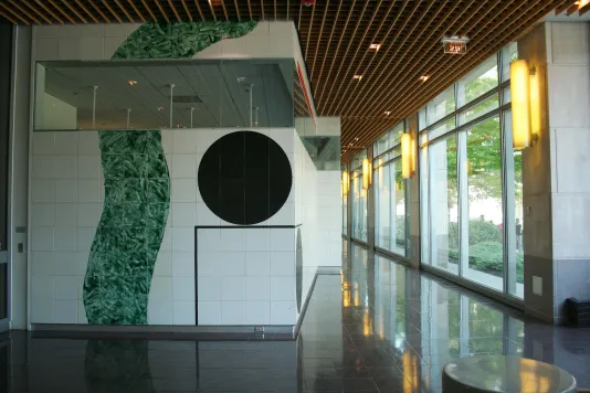 225-foot-long ceramic mural installed along a hallway with one long wall of windows