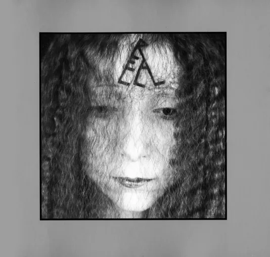 Book cover for Still Performances features a black and white image of a girl's face.