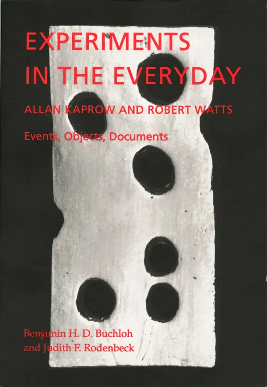 Black book cover for Experiments in the Everyday: Allan Kaprow and Robert Watts-Events,  Objects, Documents with red text and a wooden sculpture that has holes in it resembling a slice of Swiss cheese.