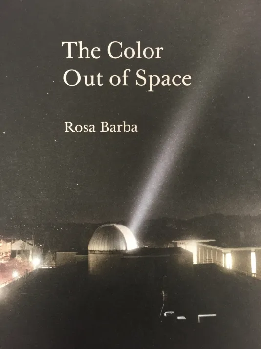 Book cover for The Color Out of Space featuring a night sky lit only by light illuminating from buildings in the foreground.