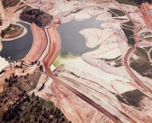 Aerial view of a mining sit with two small bodies of water.
